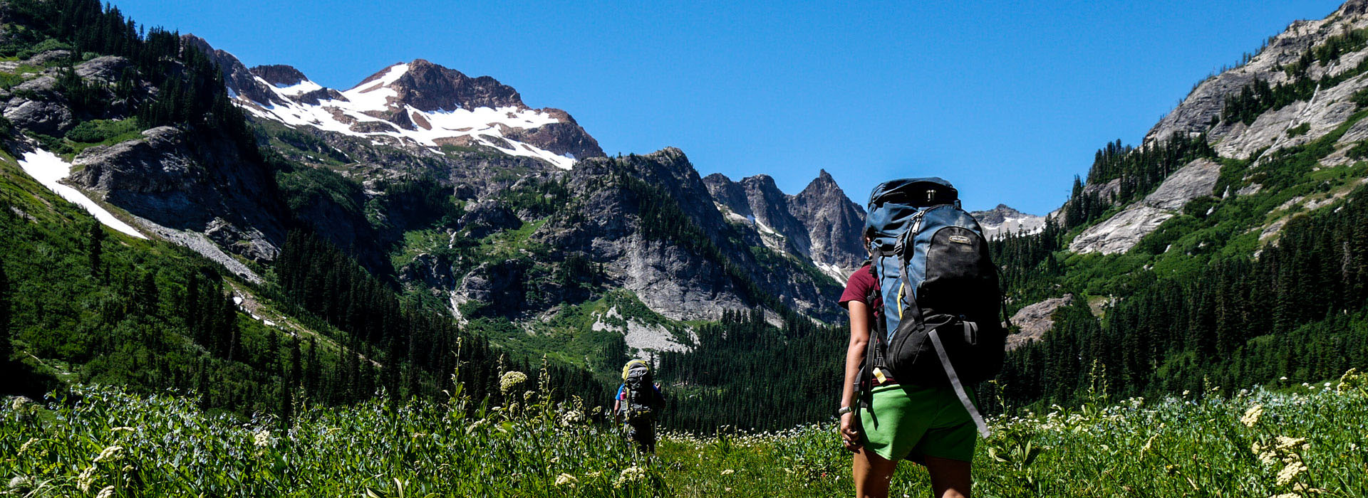 A group of people hiking in the mountains