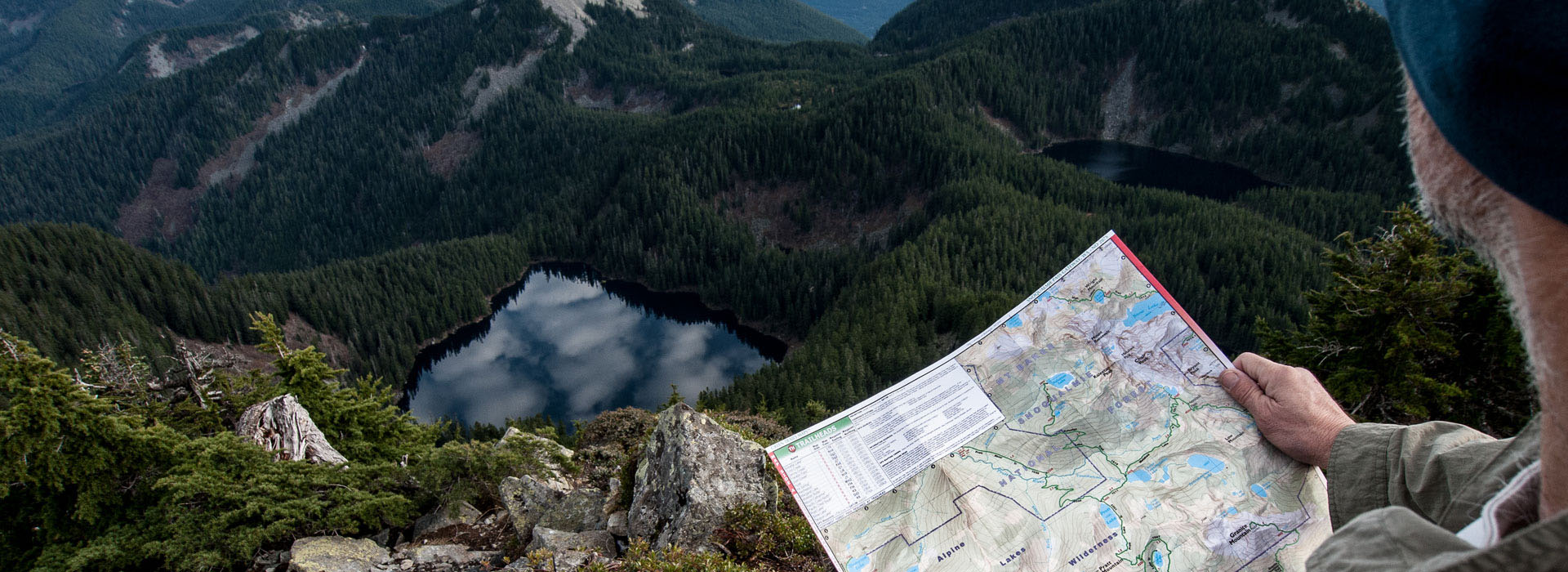 A map is on the ground near some trees